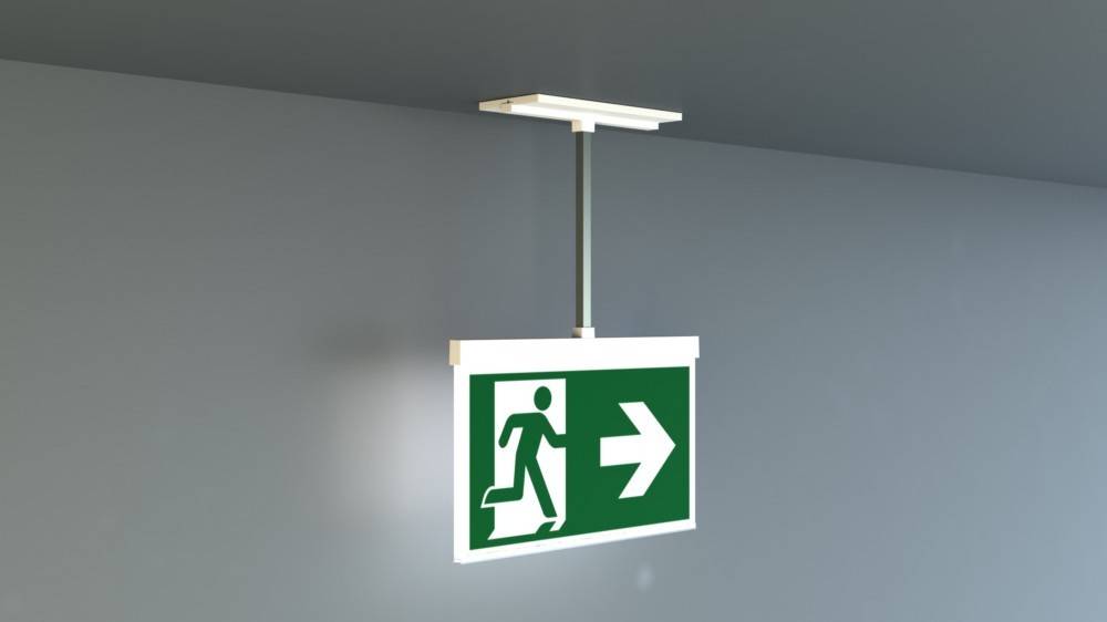 Notausgangsschild mit einer laufenden Person, die auf einen nach rechts weisenden Pfeil zuläuft und die Richtung zum Ausgang anzeigt.