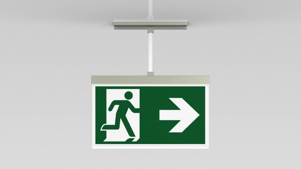 Notausgangsschild mit laufender Figur und nach rechts weisender Pfeil, der die Richtung zum Ausgang anzeigt.