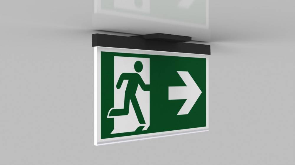 Notausgangsschild mit einer laufenden Person, die auf einen nach rechts weisenden Pfeil zuläuft und so die Richtung zum Ausgang anzeigt.