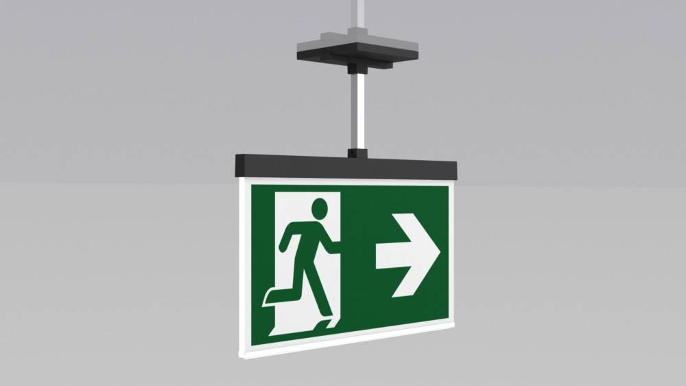 Notausgangsschild mit einer Figur, die nach rechts läuft und auf eine Fluchtroute hinweist.