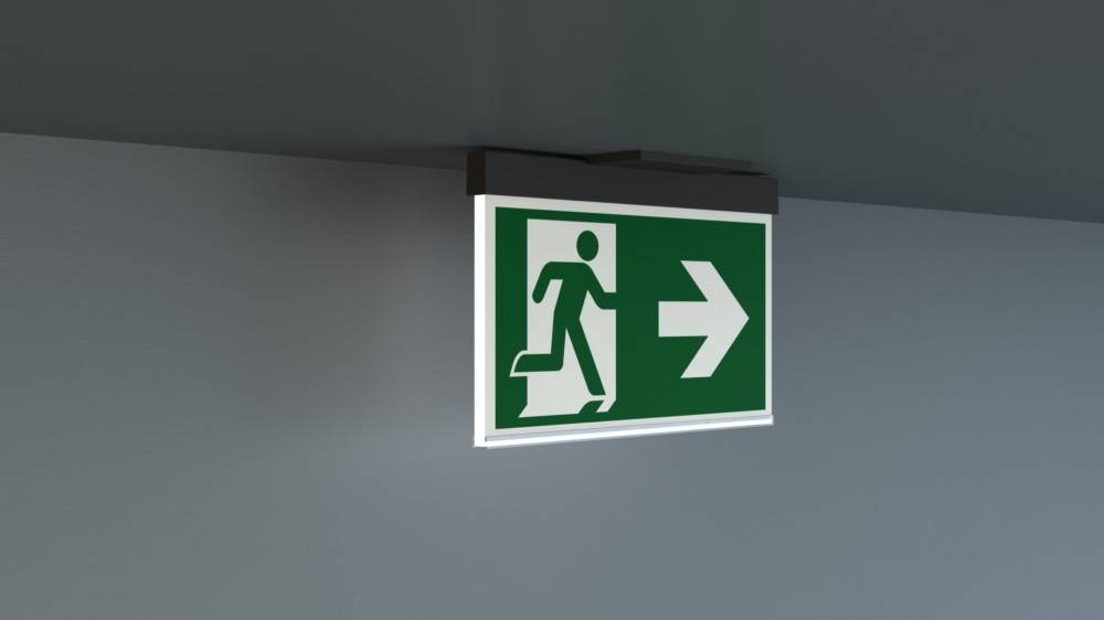 Beleuchtetes Notausgangsschild mit einer laufenden Figur und einem nach rechts weisenden Pfeil, der die Richtung zum nächstgelegenen Ausgang anzeigt.