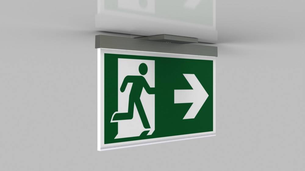 Beleuchtetes Fluchtzeichenschild, das eine laufende Person zeigt, die durch eine Tür mit einem nach rechts gerichteten Pfeil geht und die Richtung zum Ausgang angibt.