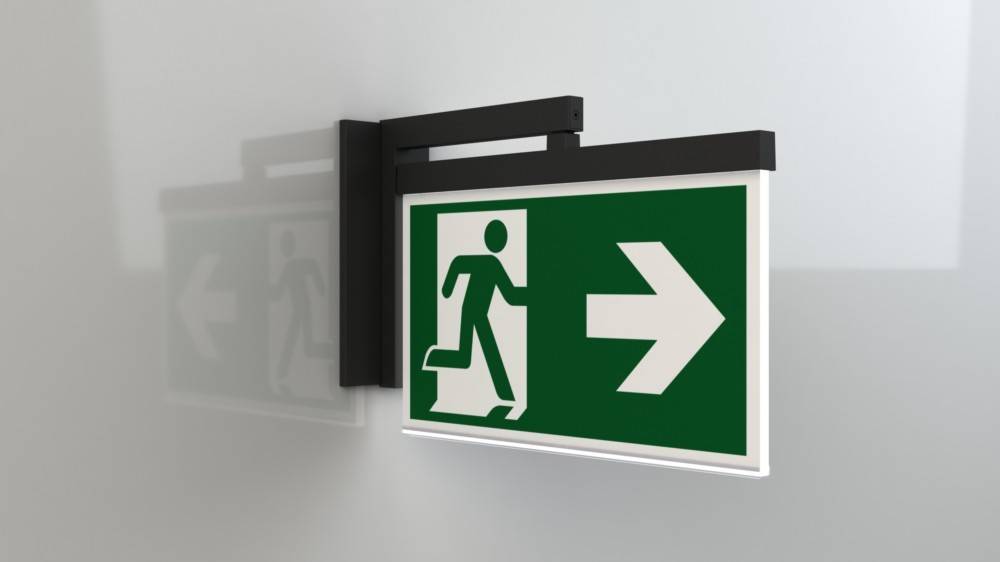 Notausgang-Schild mit einer weißen Figur, die durch eine Tür läuft und nach rechts zeigt, auf grünem Hintergrund.