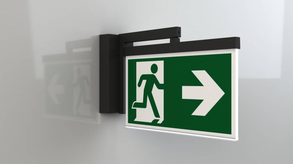Notausgangsschild mit einer laufenden Person, die auf einen nach rechts weisenden Pfeil zuläuft und damit die Richtung des Ausgangs anzeigt.