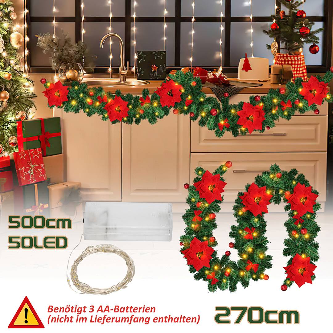 Weihnachtsgirlande mit roten Weihnachtssternen und warmen Lichtern, die eine Küche dekorieren, gezeigt mit batteriebetriebener LED-Längenkennzeichnung '500 cm', '270 cm' und deutschem Text über 3 AA-Batterien nicht im Lieferumfang enthalten.