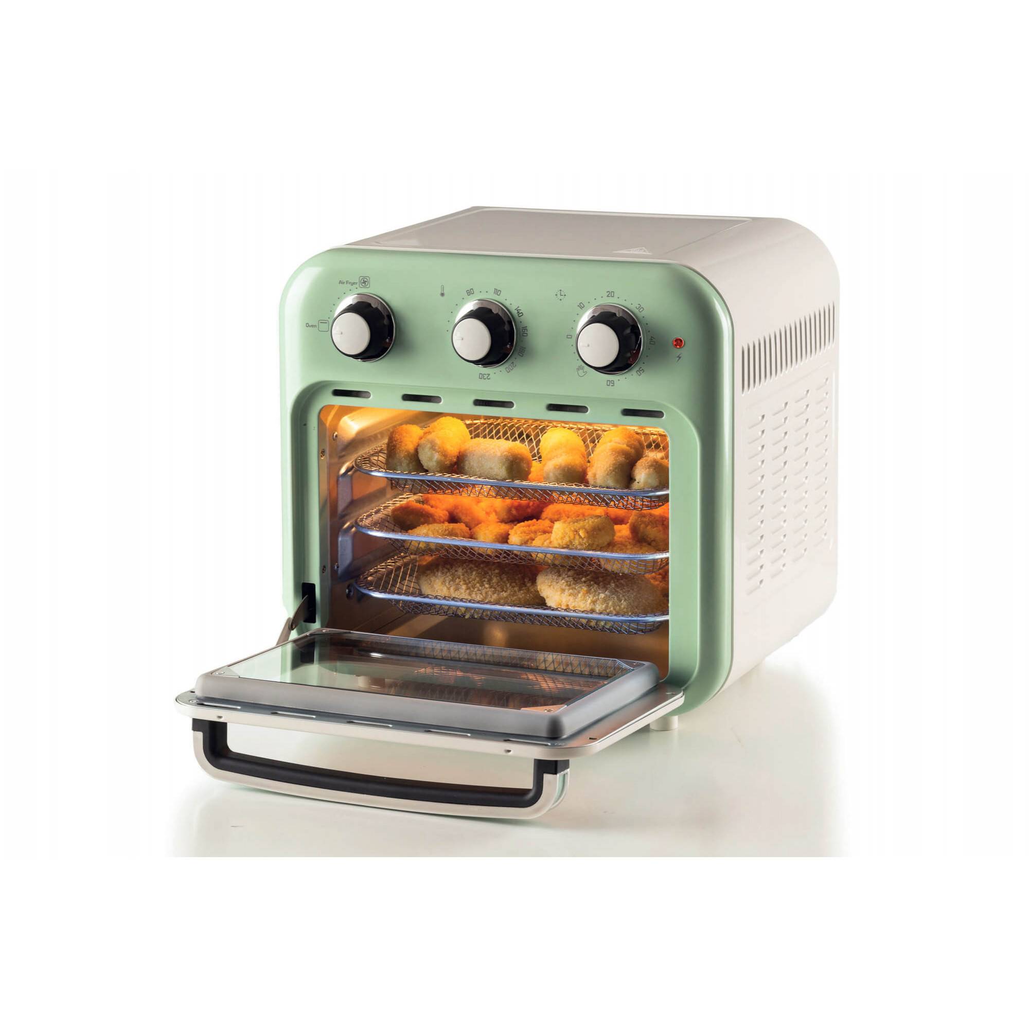 Offener Tischtoaster mit Glastür, drei Bedienregler und beleuchtetes Inneres mit gekochtem Essen auf drei Gittern.