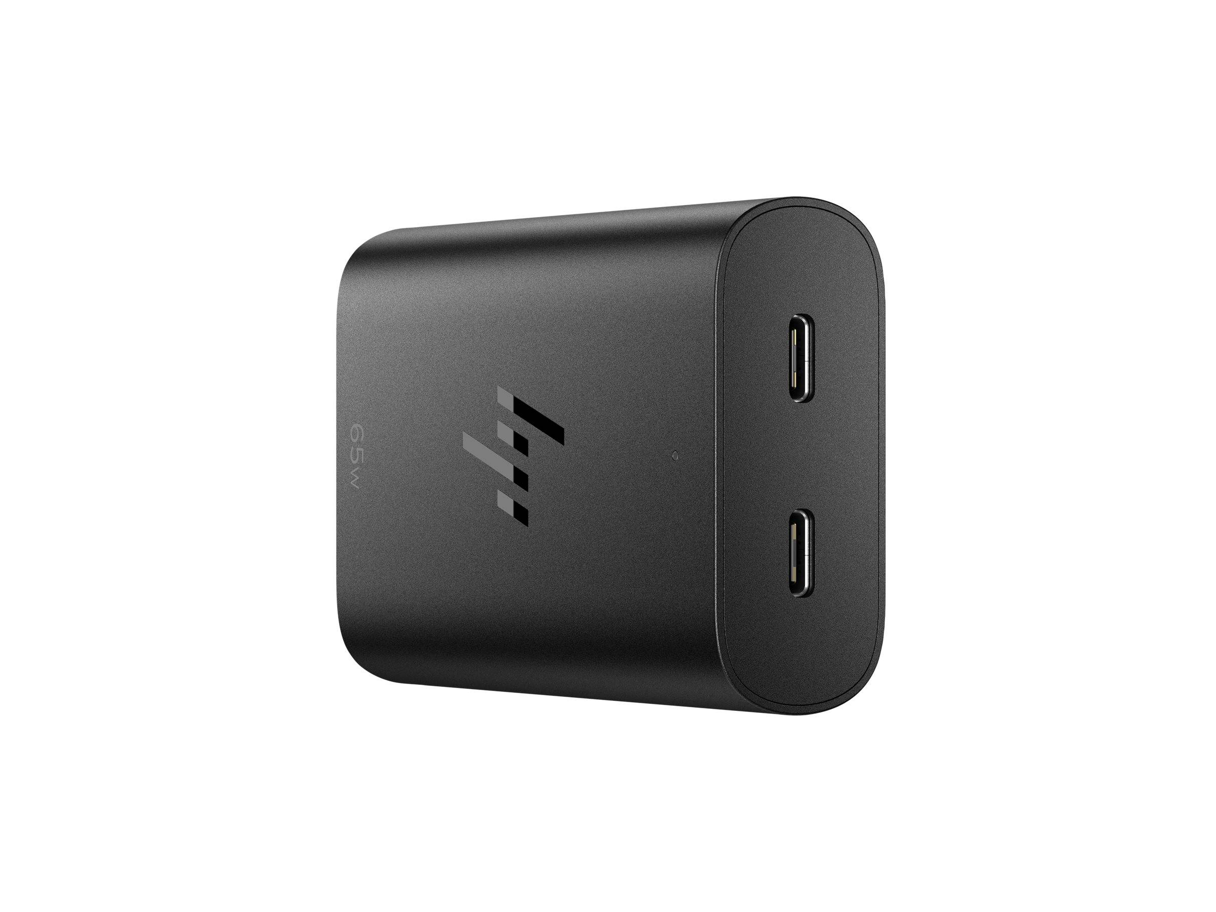 Ein schwarzes 65W-Netzteil mit zwei USB-C-Anschlüssen an seiner Vorderseite.