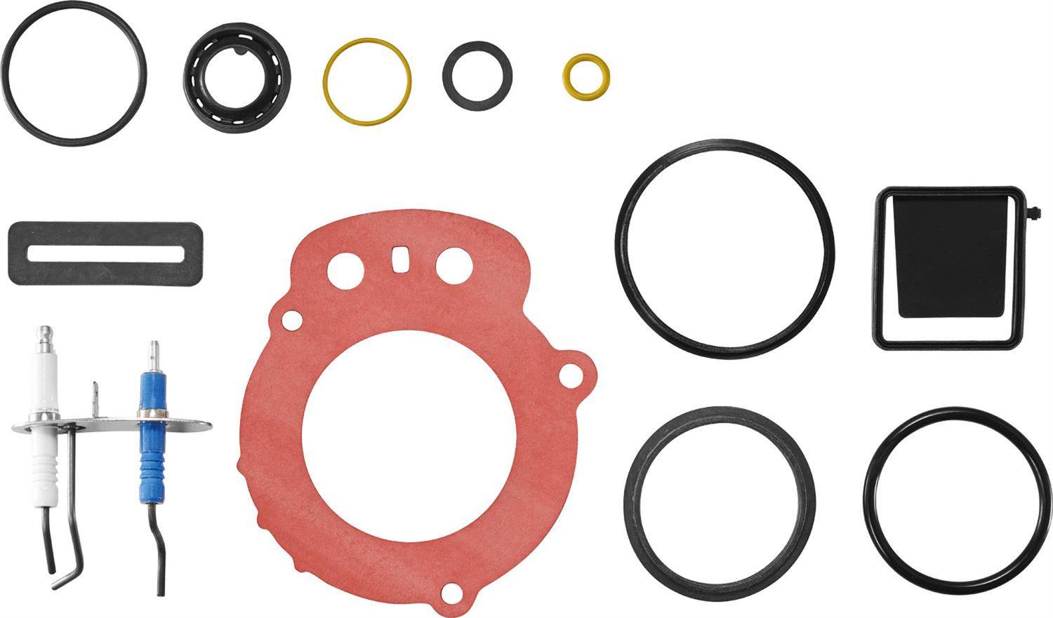 Sortiment von Motordichtungen und O-Ringen, angeordnet mit zwei Zündkerzen, einer rechteckigen Dichtung und einem schwarzen Rahmen auf weißem Hintergrund.