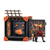 Spielzeugmonsterfigur neben einem geöffneten schwarz-orangenen Käfig mit einem knurrendem Gesicht im Inneren, gestaltet wie ein gruseliges Spielset.