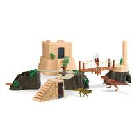 Dinosaurier-Spielzeugset mit Tempelruinen, Brücke, Klippen und mehreren kleinen Dinosaurier-Figuren auf weißem Hintergrund.