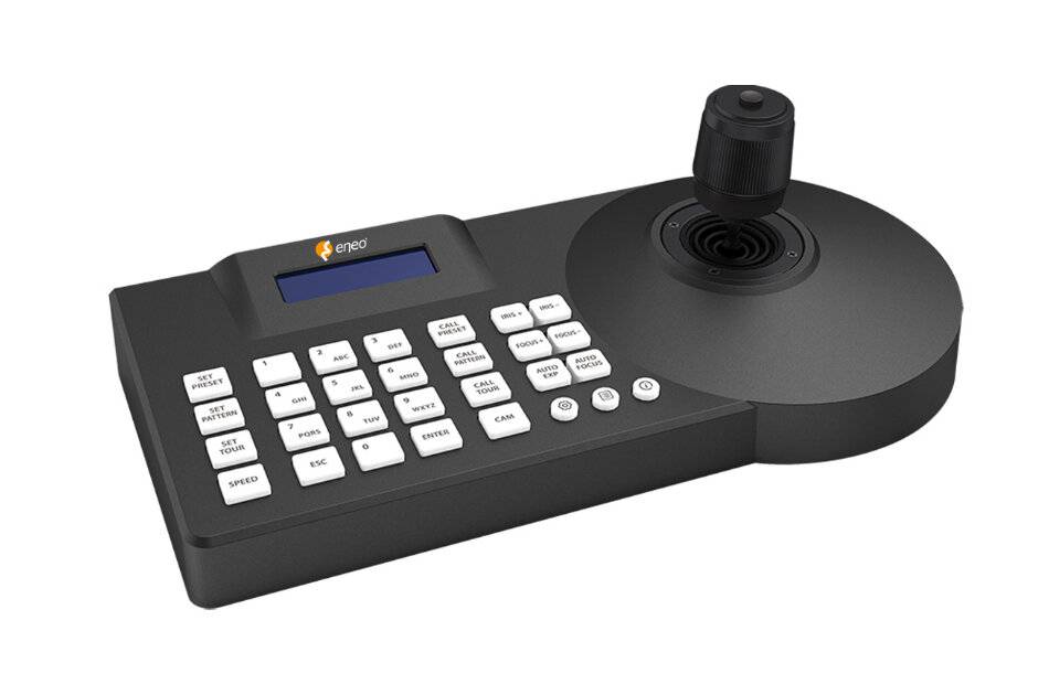 Schwarze elektronische Steuerkonsole mit kleinem Display, vielen beschrifteten Tasten und einem Joystick auf der rechten Seite.