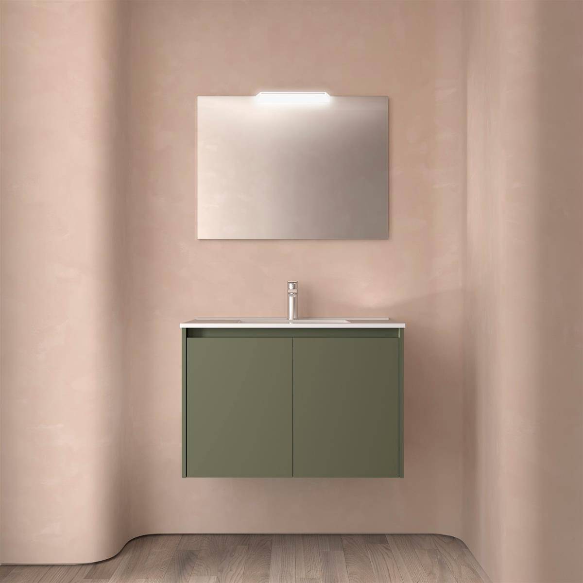 Minimalistischer Badezimmerwaschbereich mit olivgrünem Schrank, Waschbecken und Spiegel vor einer beige Wand und Holzboden.