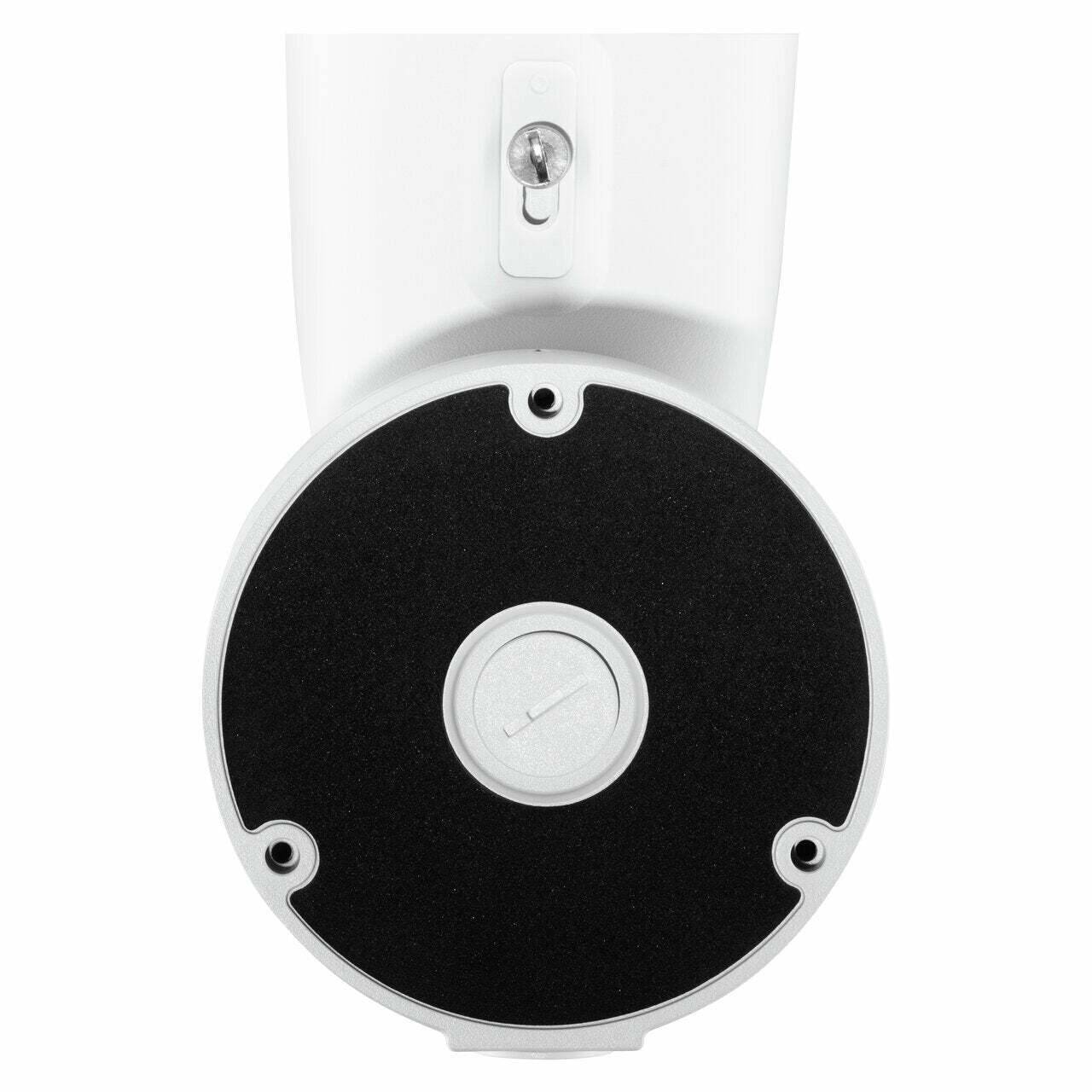 Eine Nahaufnahme eines weißen zylindrischen Objekts mit einer schwarzen kreisförmigen Basis, das einen zentralen Drehregler und eine kleine Schraube oben aufweist.