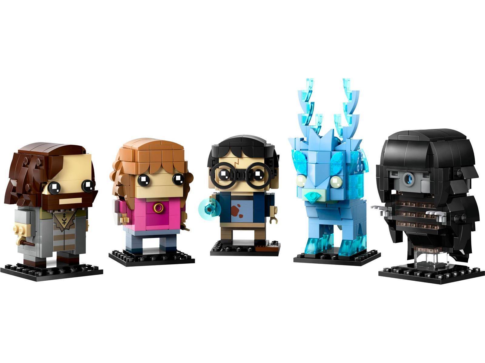 Fünf LEGO-ähnliche Ziegelfiguren aus Harry Potter, darunter Hermione, Ron, Hagrid, eine blaue Kreatur und Darth Vader, auf weißem Hintergrund.