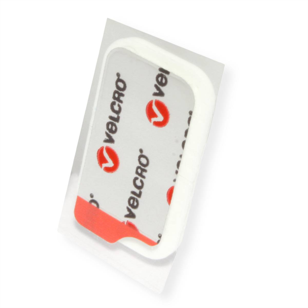 Ein Klebeband der Marke Velcro mit rotem Logo und Text auf einer durchsichtigen rechteckigen Grundlage, verwendet zum Befestigen leichter Gegenstände.