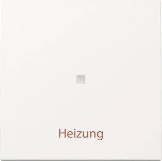 Ein weißer Schalter mit einem kleinen quadratischen Knopf in der Mitte, darunter in brauner Schrift mit „Heizung