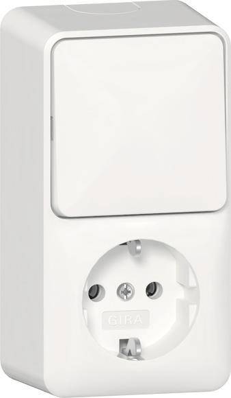 Eine europäische elektrische Wandsteckdose mit zwei runden Steckplätzen und einem Erdungsloch, in Nahaufnahme gezeigt, wobei das Design betont wird.