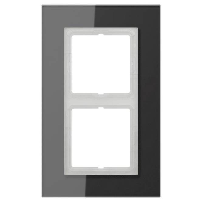 Eine glänzend schwarze doppelte Lichtschalter-Blende mit zwei rechteckigen Ausschnitten für Schalter.
