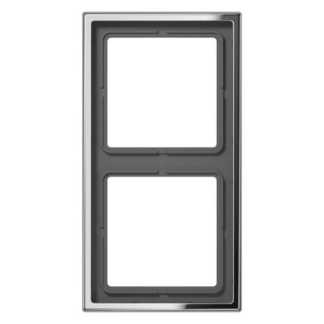 Ein rechteckiger Geräterahmen mit zwei leeren Steckplätzen, möglicherweise zur Installation von Komponenten oder Schaltern, vor einem weißen Hintergrund.