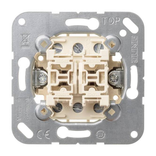 Lichtschalter-Mechanismus mit Metallrahmen, beigen Tasten und der Beschriftung „TOP
