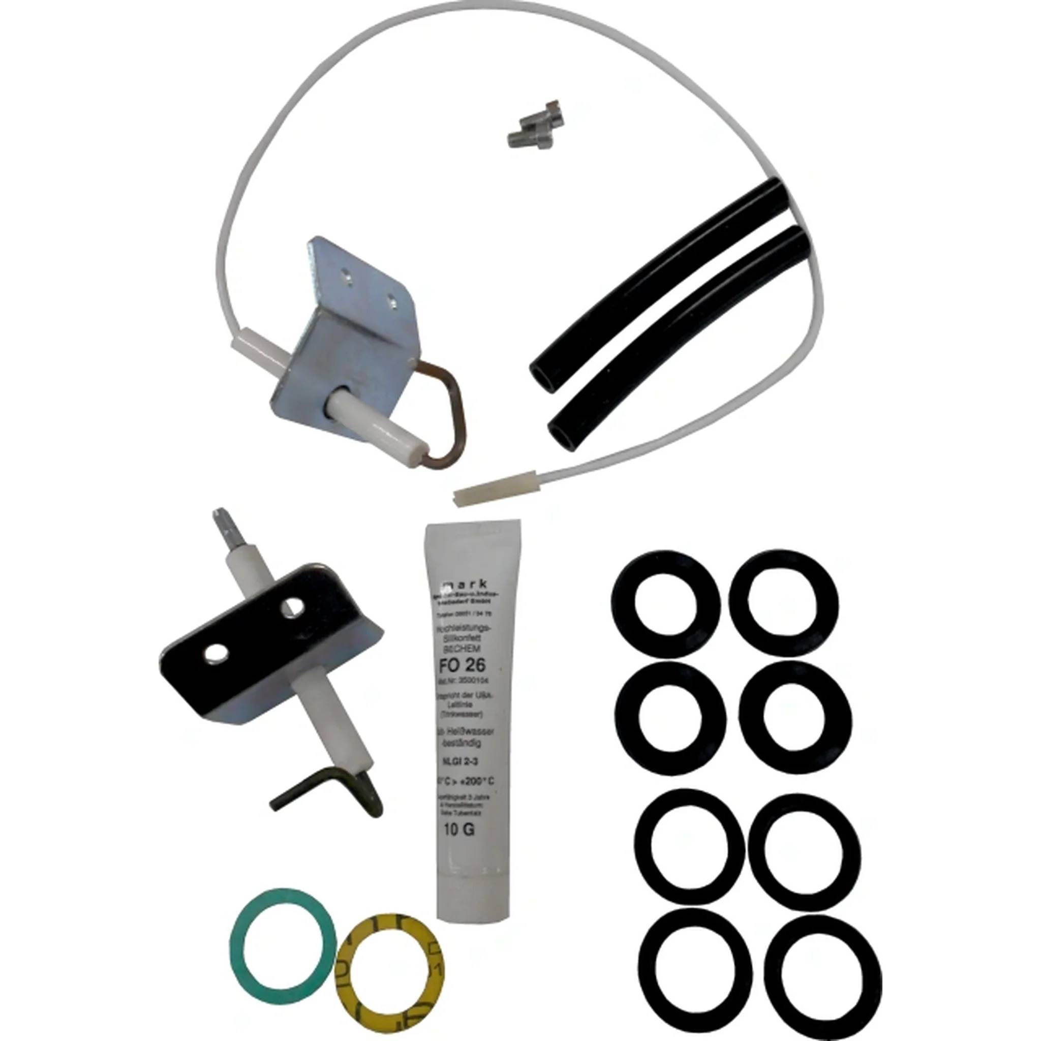 Sortiertes Gerätewartungs-Set mit Metallklammern, Kabel, Schlauch, Fettpatrone und mehreren schwarzen und farbigen O-Ringen auf weißem Hintergrund.