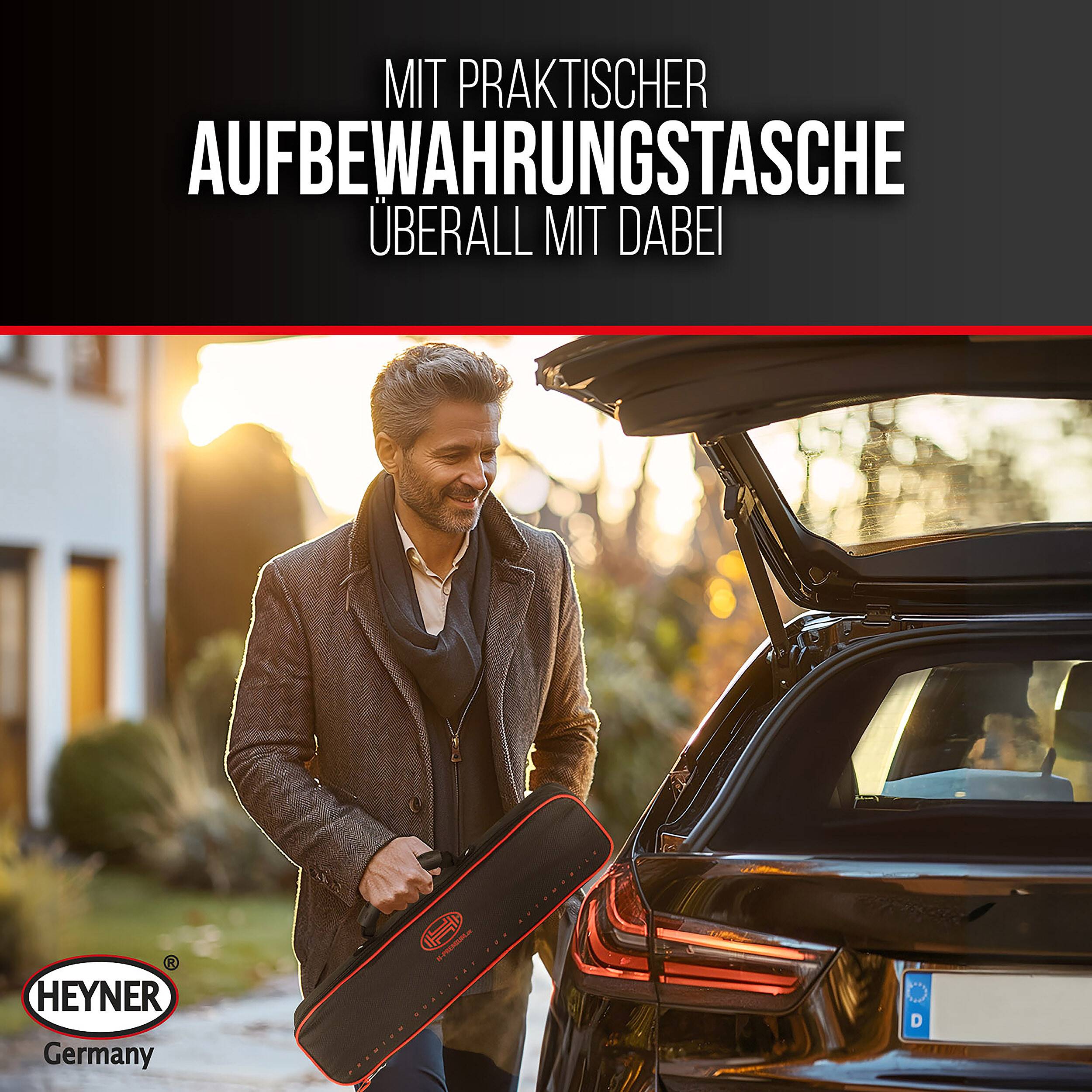 Ein Mann lädt eine praktische Aufbewahrungstasche in den offenen Kofferraum eines Autos, mit deutschem Text, der lautet „Mit praktischer Aufbewahrungstasche überall mit dabei