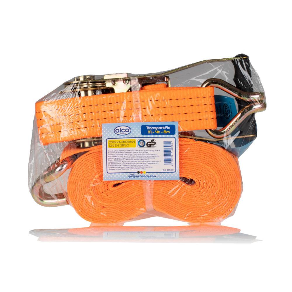 Orangefarbenes Ratschengurt mit Metallhaken und Schnalle, in durchsichtiger Kunststoffverpackung verpackt. Etikett mit Aufschrift „Transportfix 1t, 6-8m