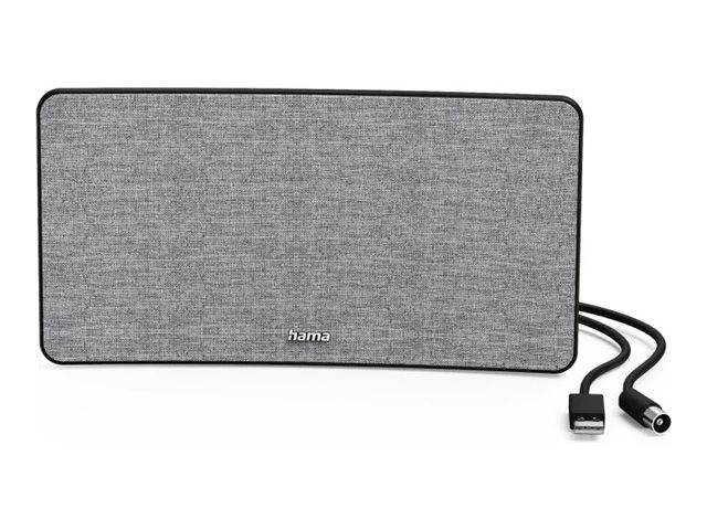 Ein rechteckiger grauer Lautsprecher, mit Stoffbezug und dem 'hama'-Logo in der Mitte, der rechts durch ein Netzkabel angeschlossen ist.