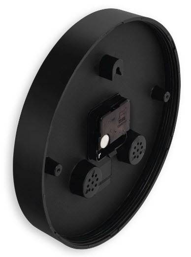 Schwarzes rundes, wandmontiertes Gerät von hinten gezeigt, mit zentralem Batteriefach und zwei kleinen perforierten Lautsprecher- oder Lüftungsöffnungen.
