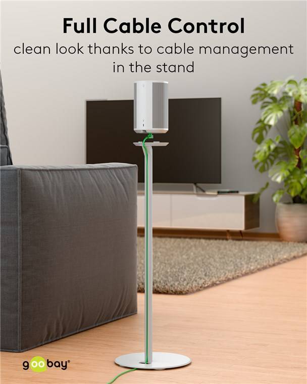 Stehleuchte mit Kabelmanagement neben einem grauen Sofa und Fernseher, Pflanze auf der rechten Seite, Text lautet „sauberes Aussehen dank Kabelmanagement im Fuß