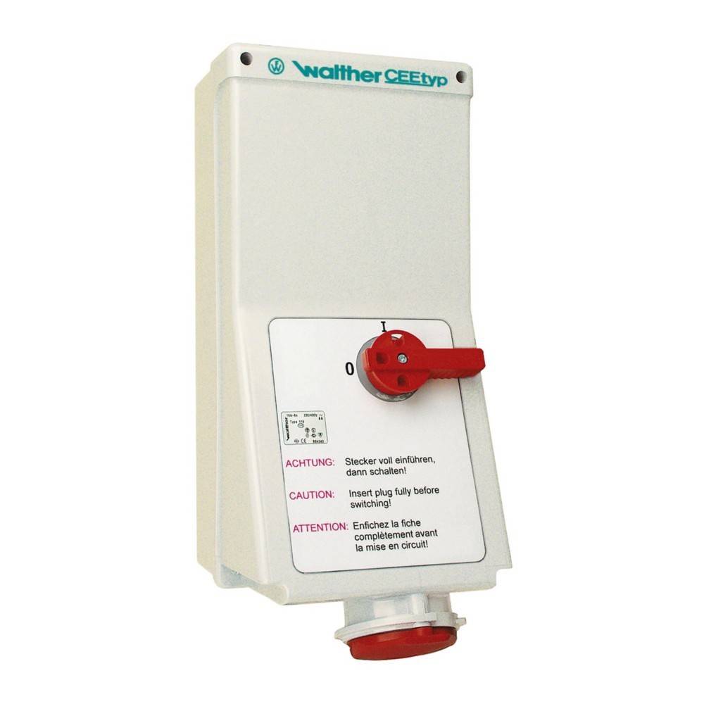 Elektrische Schaltbox mit einem roten Wahlschalter, beschriftet mit 'Waltther CEETyp.' Warnhinweise auf Deutsch, Englisch und Französisch empfehlen, den Stecker vor dem Schalten vollständig einzustecken.