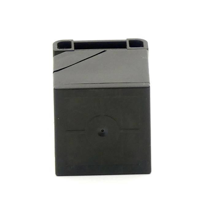 Schwarzes rechteckiges Kunststoffgerät oder eine schwarze rechteckige Kunststoffkartusche mit grauem Oberteil und zentraler kreisförmiger Öffnung auf weißem Hintergrund.