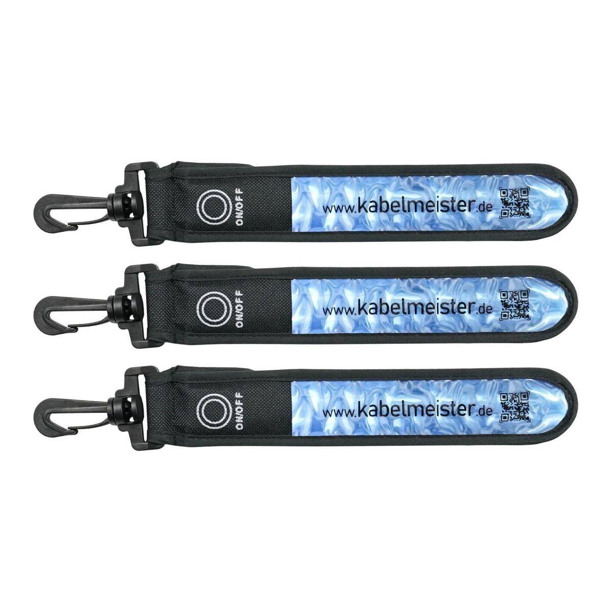 Drei schwarze Kabelorganizer aus Kunststoffband mit Haken, beschriftet mit „kabelmeister.de