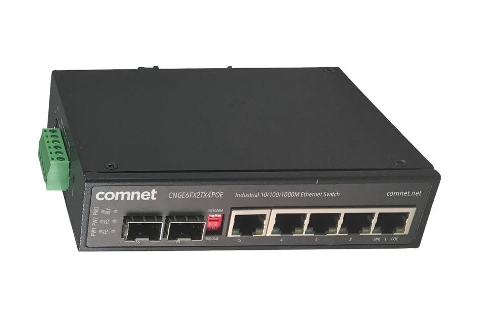 Vorderansicht eines Comnet Industrial-Ethernet-Switches mit mehreren RJ45-Anschlüssen, zwei Faseroptik-Ports und einem grünen Stromterminalblock auf der linken Seite.
