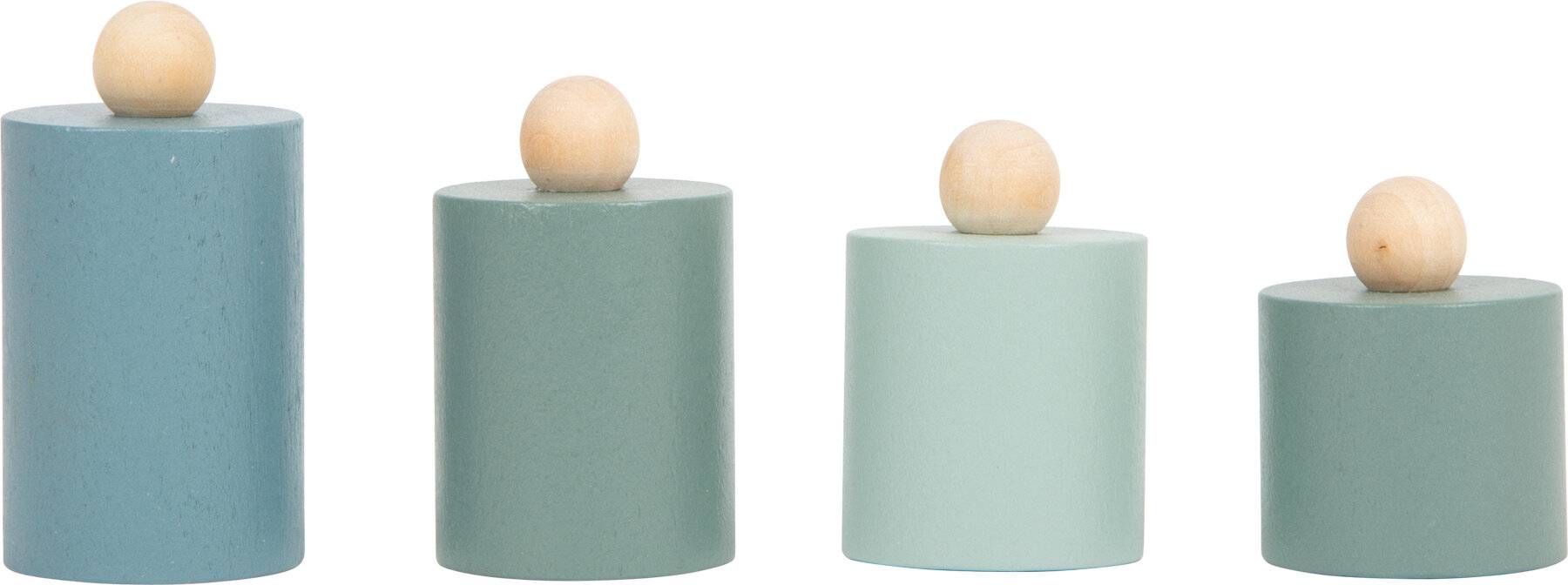 Zwei zylindrische Objekte mit runden Holzknöpfen oben. Der linke Zylinder ist größer und höher als der rechte.