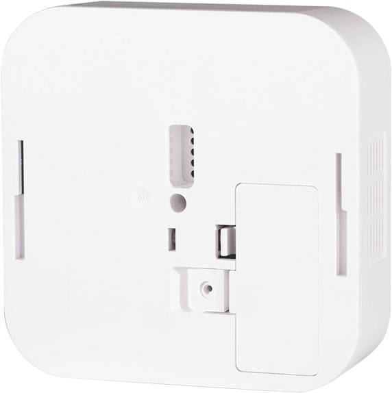Ein weißes, quadratisches elektronisches Gerät mit abgerundeten Kanten und sichtbaren Schlitzen, wahrscheinlich eine wandmontierte Steuereinheit oder ein Sensor.