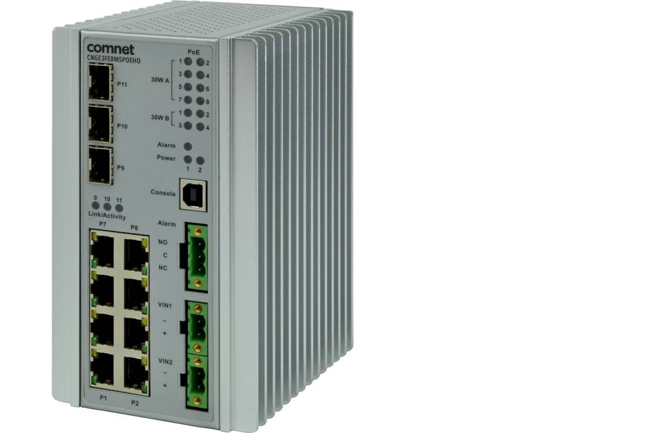 Industrieller ComNet-Netzwerkschalter mit mehreren Ethernet-Anschlüssen und Status-LEDs in einem robusten gerippten Metallgehäuse.