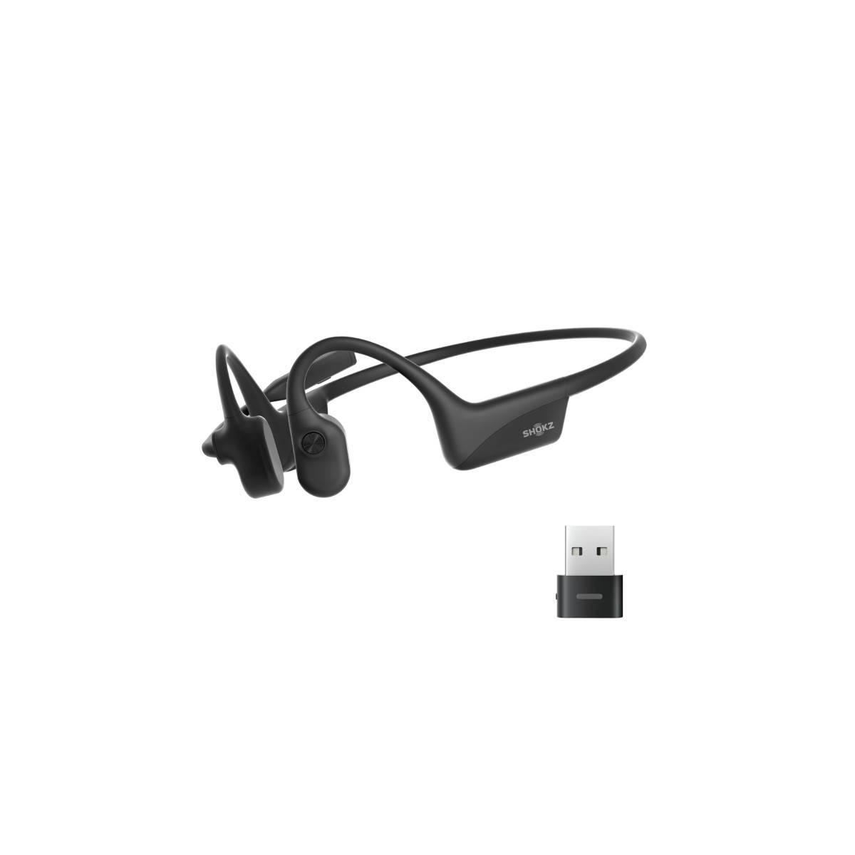 Schwarze Kopfhörer mit Knochenschall und USB-Ladekabel, konzipiert für ein kabelloses Hörerlebnis bei freien Ohren.