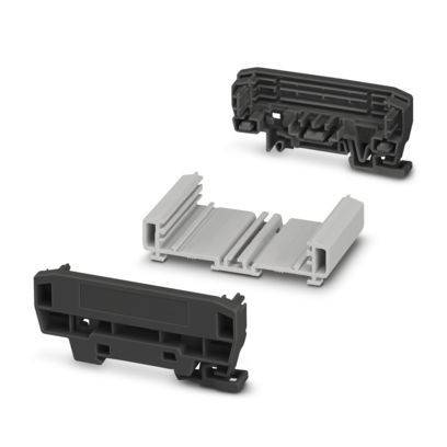 Ein grüner Vier-Klemmen-Blockverbinder, häufig für Elektroverbindungen verwendet, mit Öffnungen für die Drahteinführung oben.