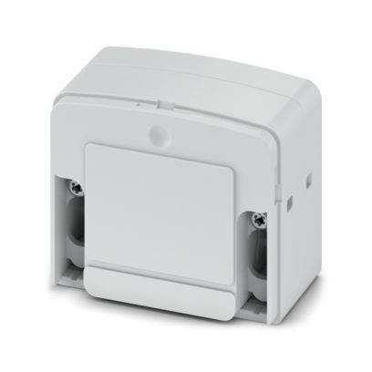 Ein weißer, rechteckiger elektrischer Schalter mit einer Schutzabdeckung, wahrscheinlich für den Außen- oder Industriebereich bestimmt, auf einer Oberfläche montiert.