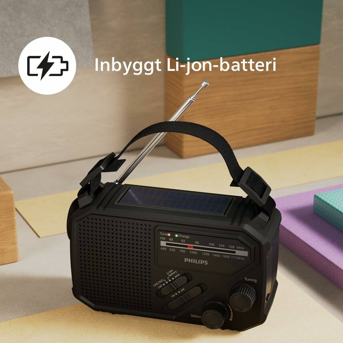 Tragbares Philips-Radio mit ausziehbarer Antenne und eingebautem Li-Ionen-Akku, auf einer Tischplatte dargestellt mit dem Text „Eingebauter Li-Ionen-Akku