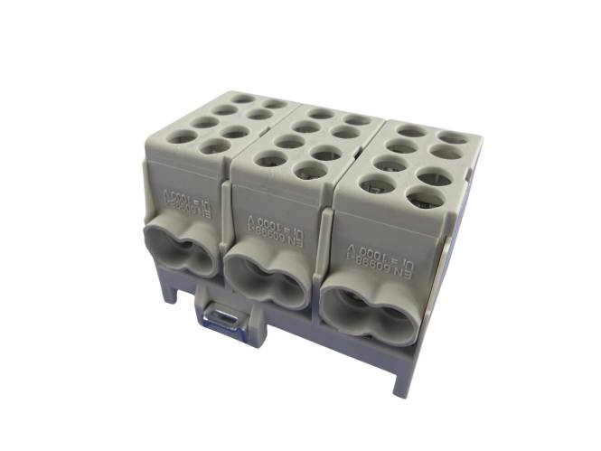 Ein dreipoliges Anschlussblock mit mehreren Löchern für elektrische Verbindungen, mit grauem Kunststoffgehäuse und modularem Design.
