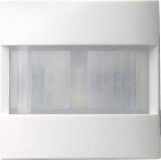 Ein weißer Bewegungsmelder mit rechteckigem Design mit zwei durchscheinenden Linsen in der Mitte. Die Linsen sind vertikal positioniert.