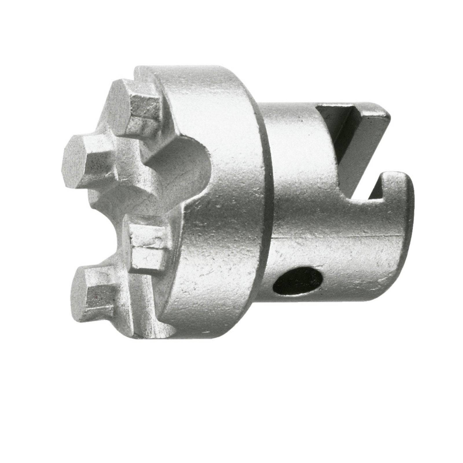 Ein metallisches Werkzeugbauteil mit asymmetrischen Kerben und einer zylindrischen Basis, das für mechanische oder industrielle Anwendungen verwendet wird.