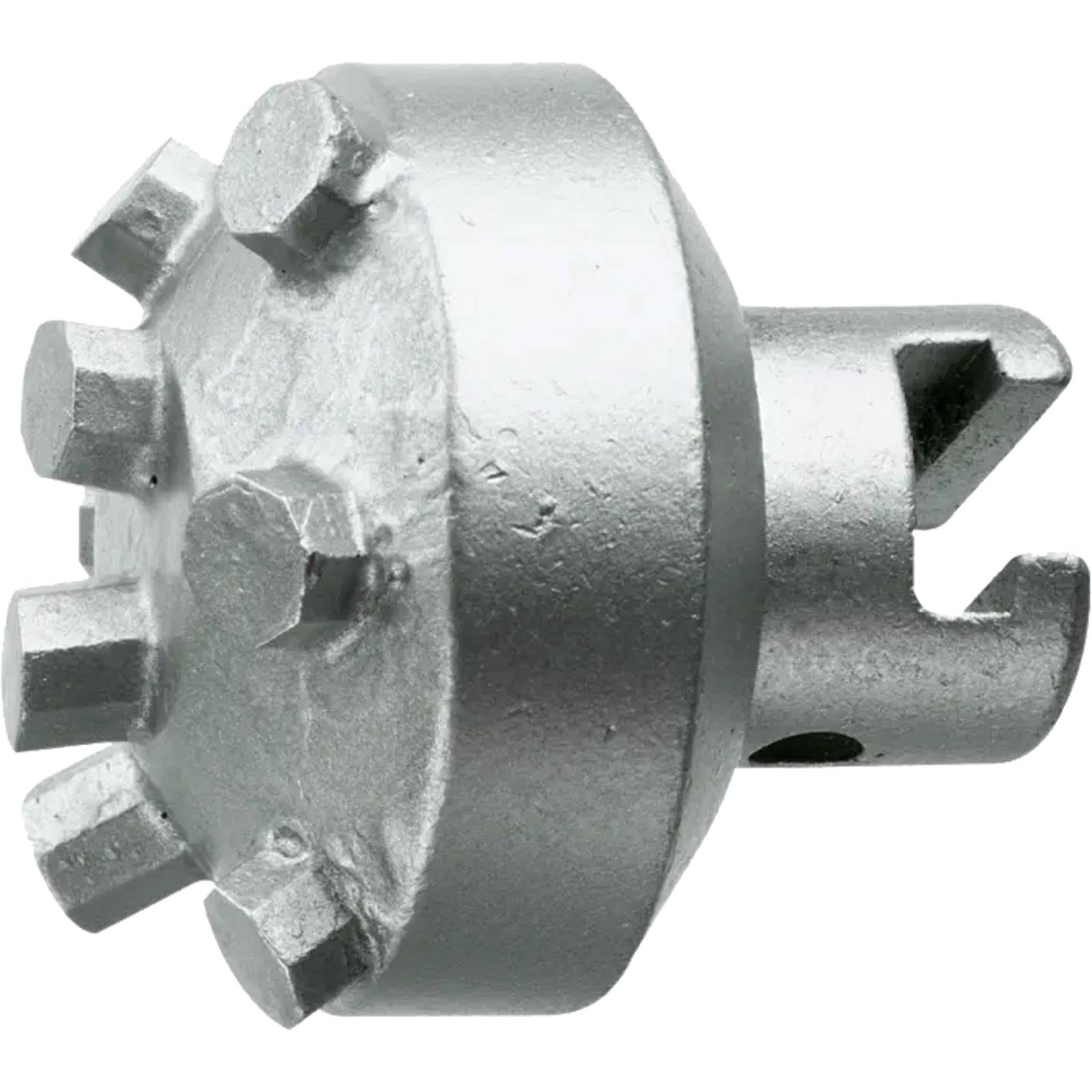 Ein metallischer Zylinder mit vorstehenden Knöpfen, der einer Zahnradoder mechanischen Komponente ähnelt, aus einem Winkel betrachtet.