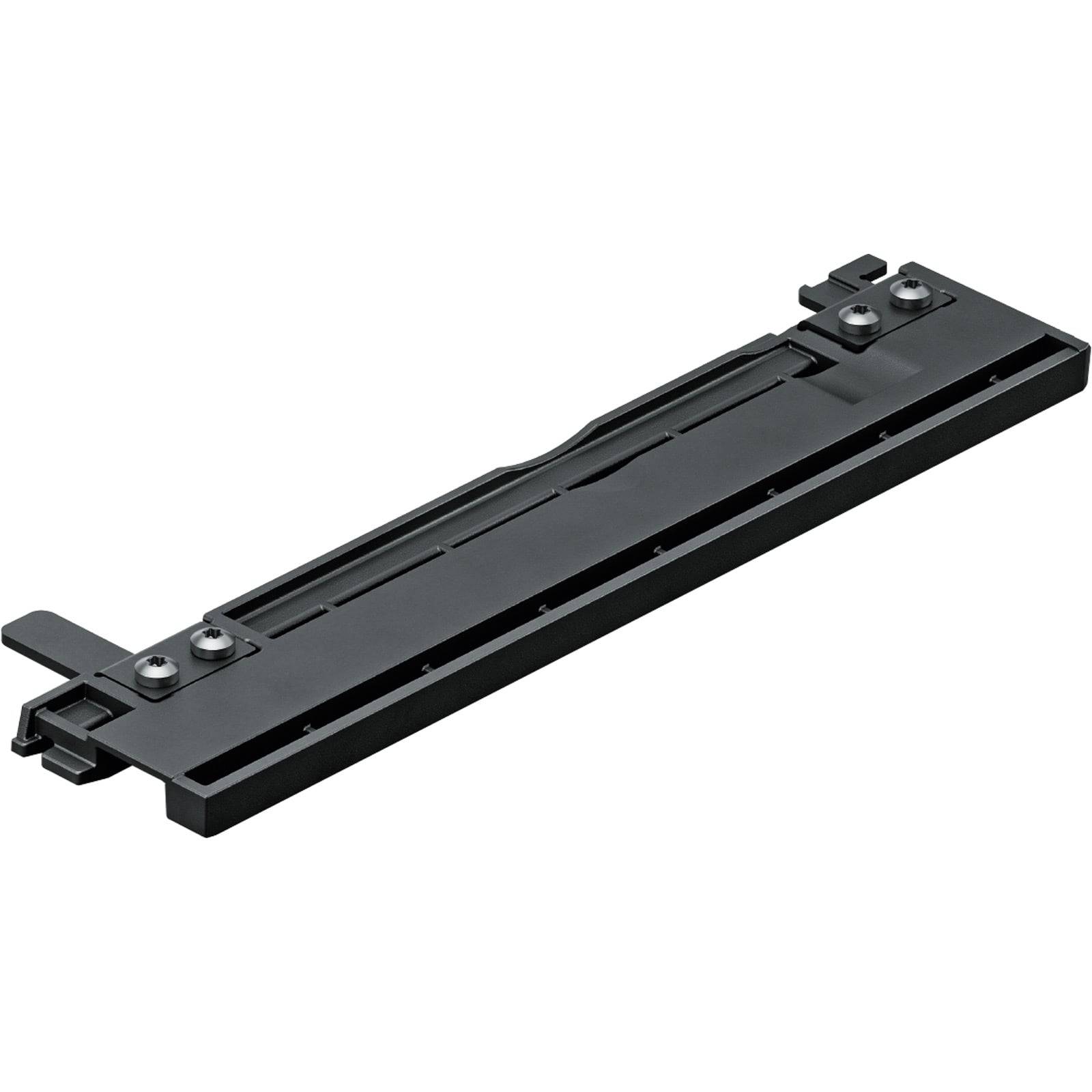 Eine schwarze, längliche Hardwarekomponente mit Befestigungshalterungen, möglicherweise ein Halter oder eine Halterung für elektronische Geräte oder Zubehör.