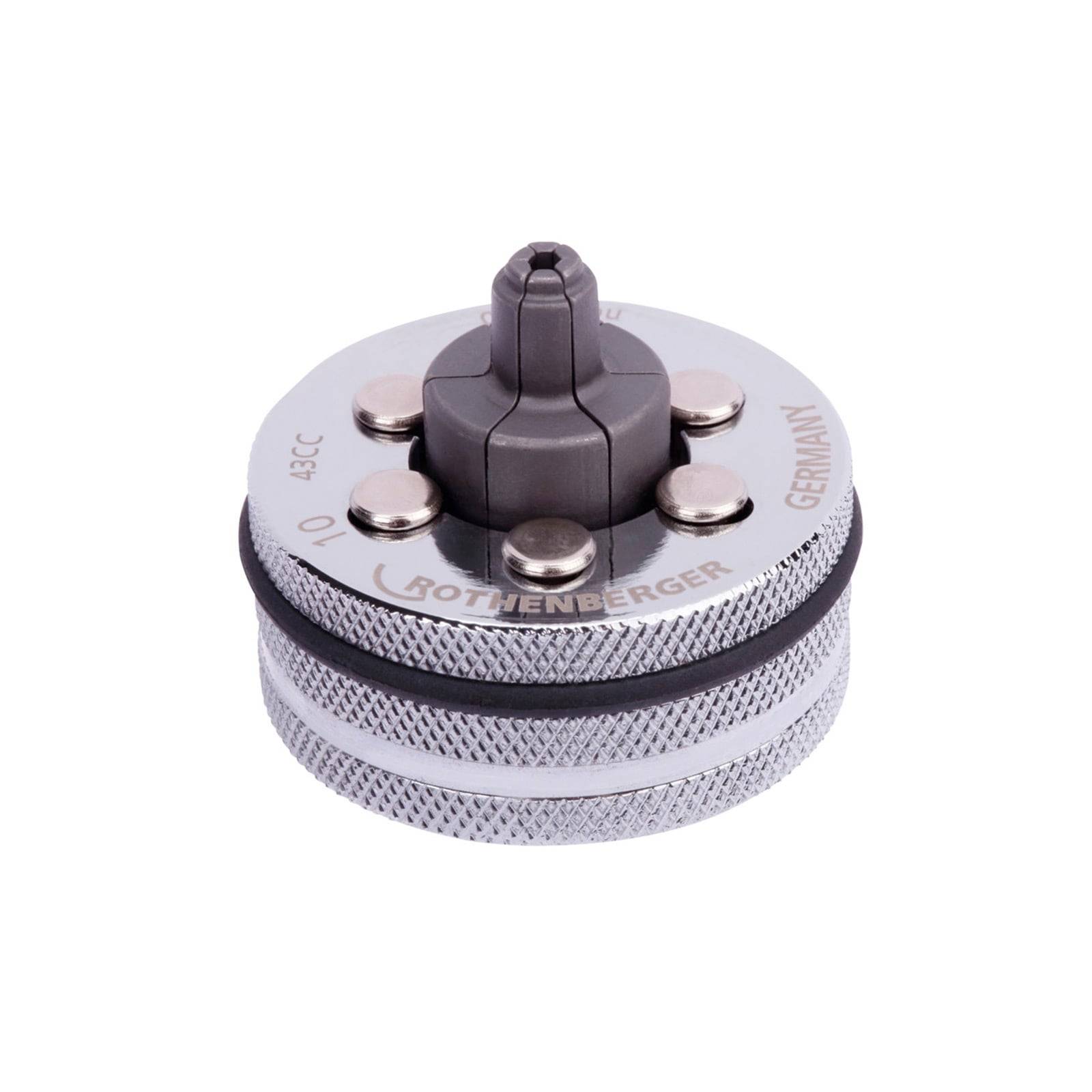 Ein zylindrisches Metallkompressor-Werkzeug mit gerillter Oberfläche und rotierendem Zentralmechanismus, beschriftet mit ‚ROTHENBERGER', ‚GERMANY', ‚10'.