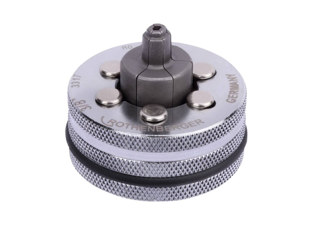 Rohrschneider von 'Rothenberger' mit silberfarbener Metalloberfläche und schwarzem Griffbereich, entwickelt für präzises Schneiden von Rohren und Leitungen.