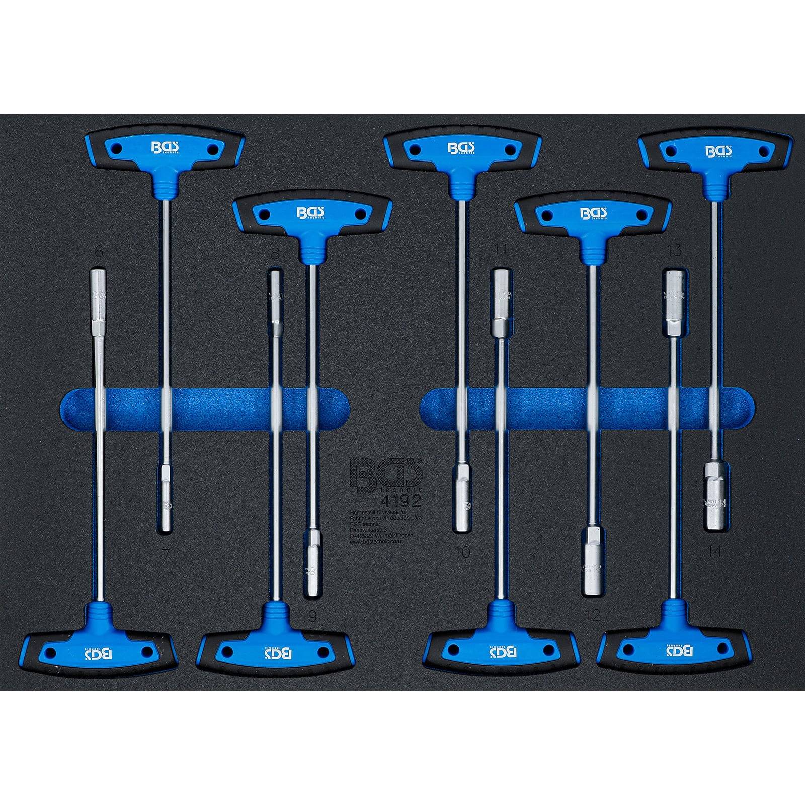 Ein Satz von acht blauen T-Griff-Schraubenschlüsseln, die in einer Schaumstoffablage organisiert sind. Die Schraubenschlüssel unterscheiden sich in der Größe und sind symmetrisch angeordnet.