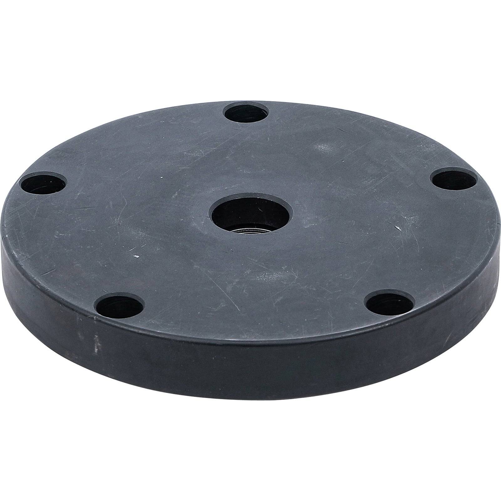 Eine runde schwarze Metallbasis mit vier gleichmäßig um den Umfang verteilten Löchern und einem zentralen Loch, die für Montagezwecke verwendet wird.